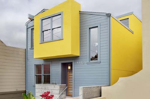 kombinasi rumah warna kuning dan abu-abu